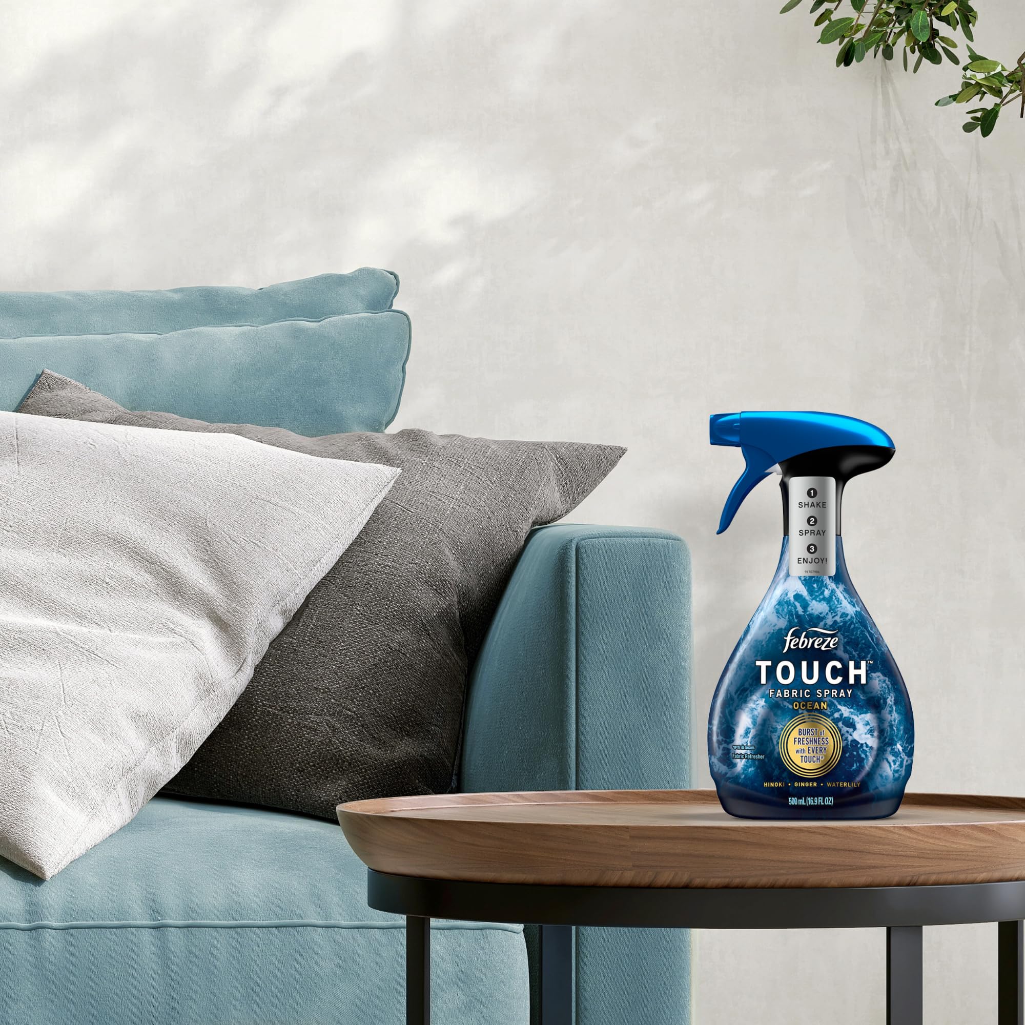 Febreze Touch next to a ruler showing 16.9oz size for scale