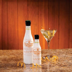 Fee Brothers orange bitters used in a cocktail setup illustrating brightened aromas and cocktail finishing