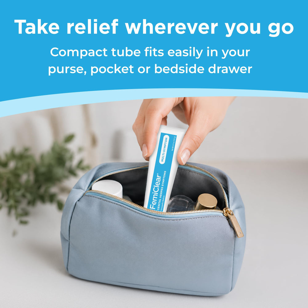 FemiClear tube held in hand demonstrating small 0.5 oz travel-friendly size