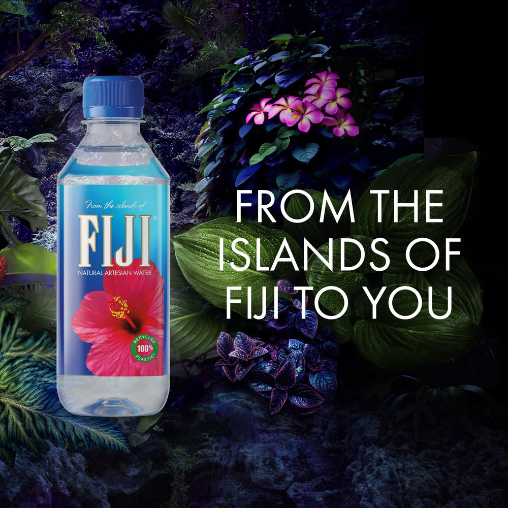 FIJI bottle held in hand to show 330mL scale and easy carry