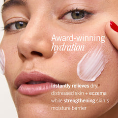 First Aid Beauty applying cream to hand for immediate moisture