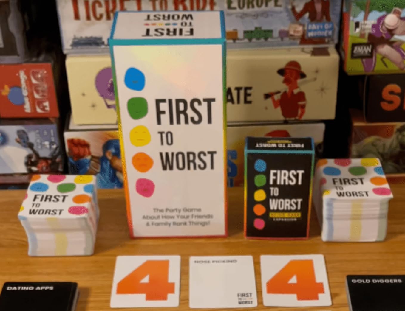 FIRST TO WORST family around table playing, illustrating multigenerational fun