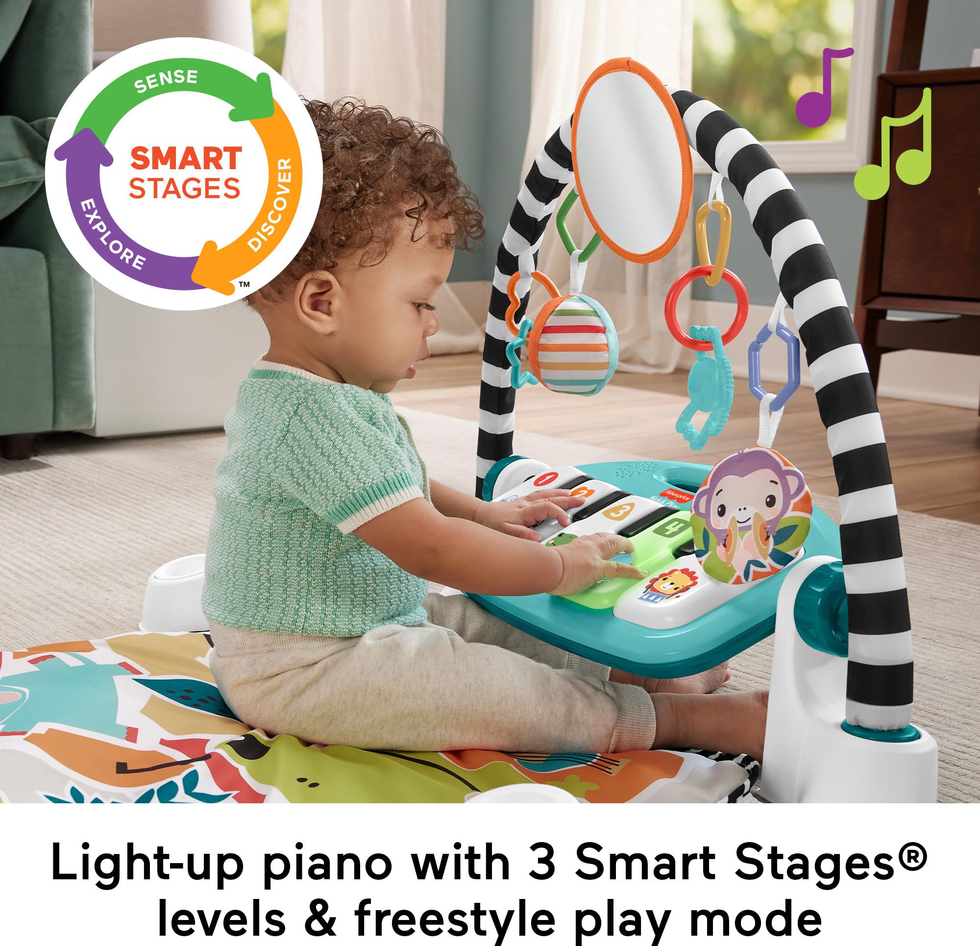 Fisher-Price baby doing tummy time on mat building strength and engagement
