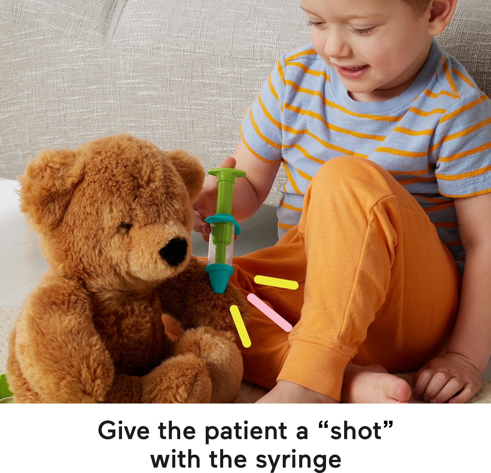 Fisher-Price syringe and bandage close-up for safe pretend care and fine-motor practice