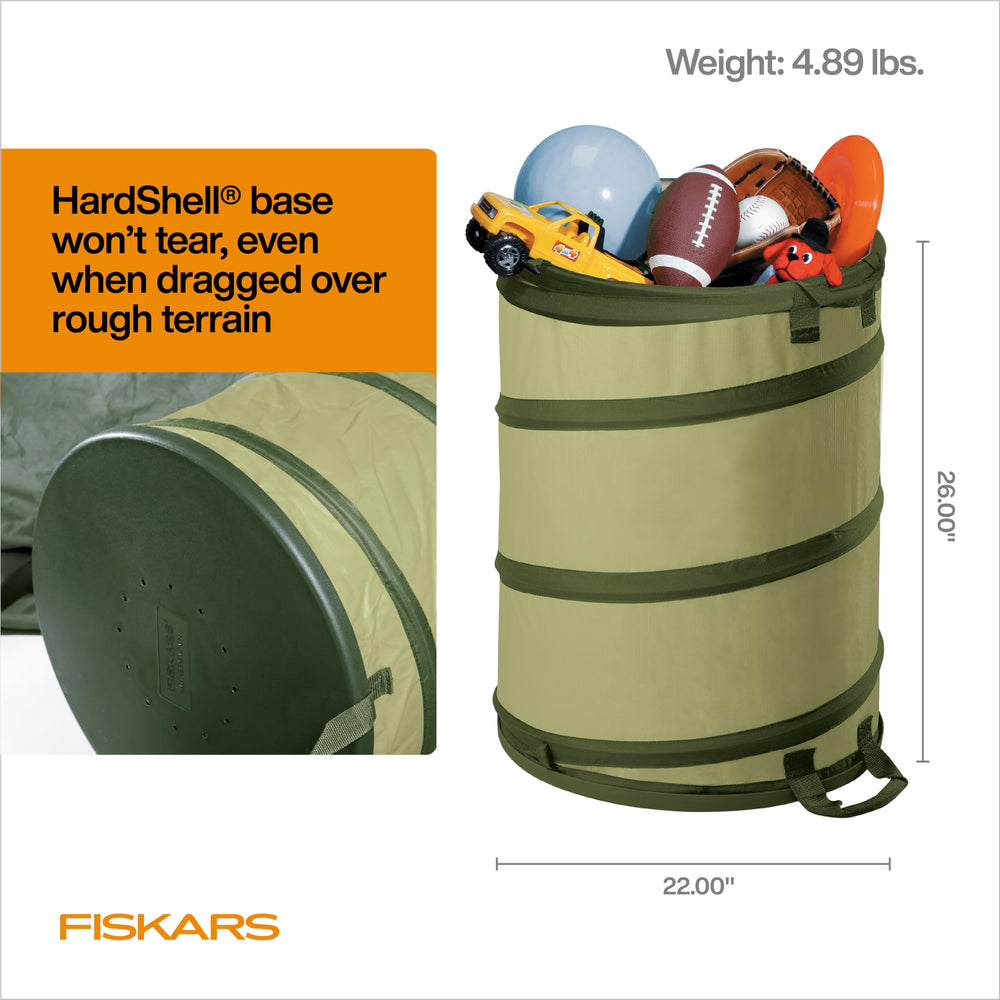 Fiskars beside a rake to show 30-gallon size advantage