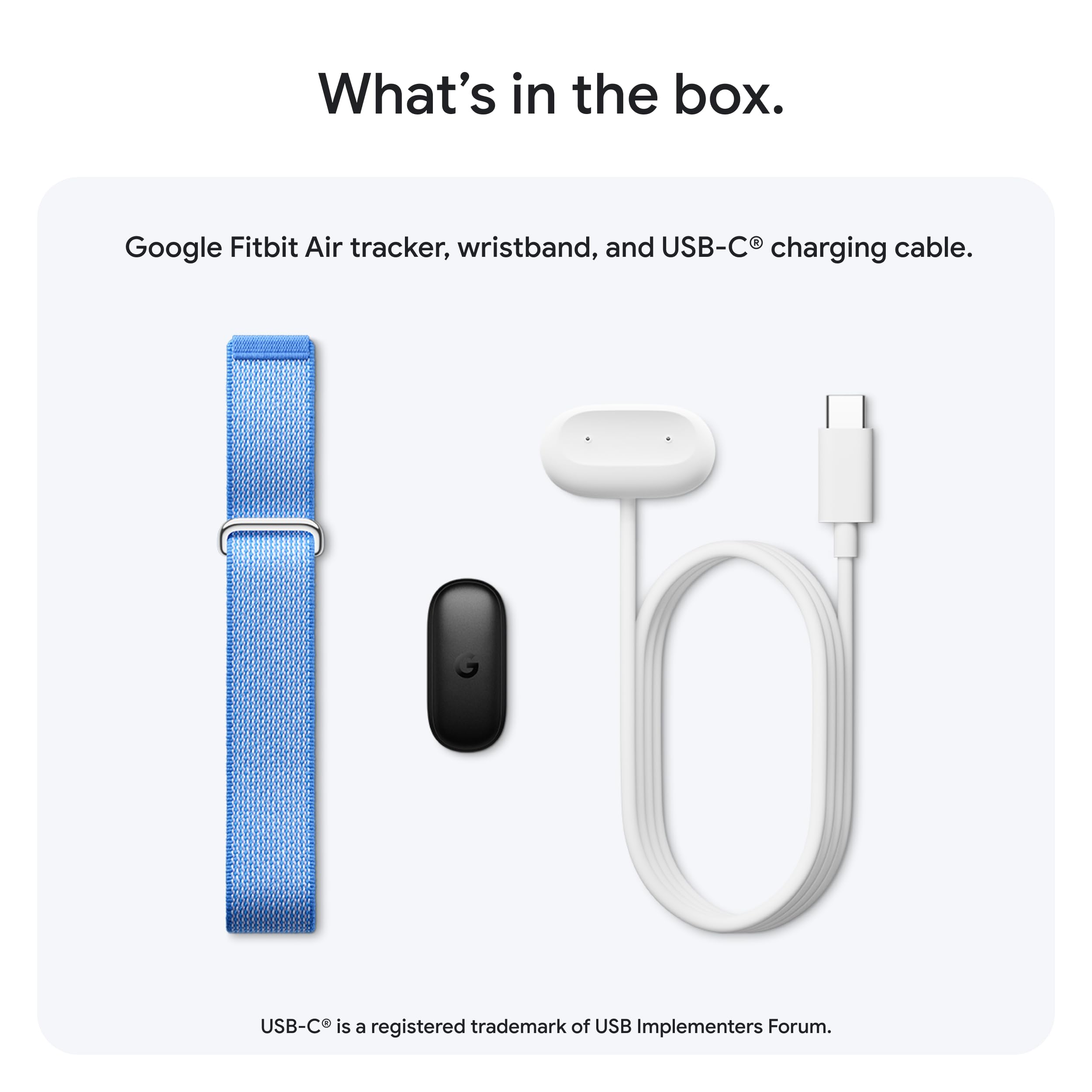 Flatlay of Fitbit Google Air packaging showing included band and clean unboxing experience