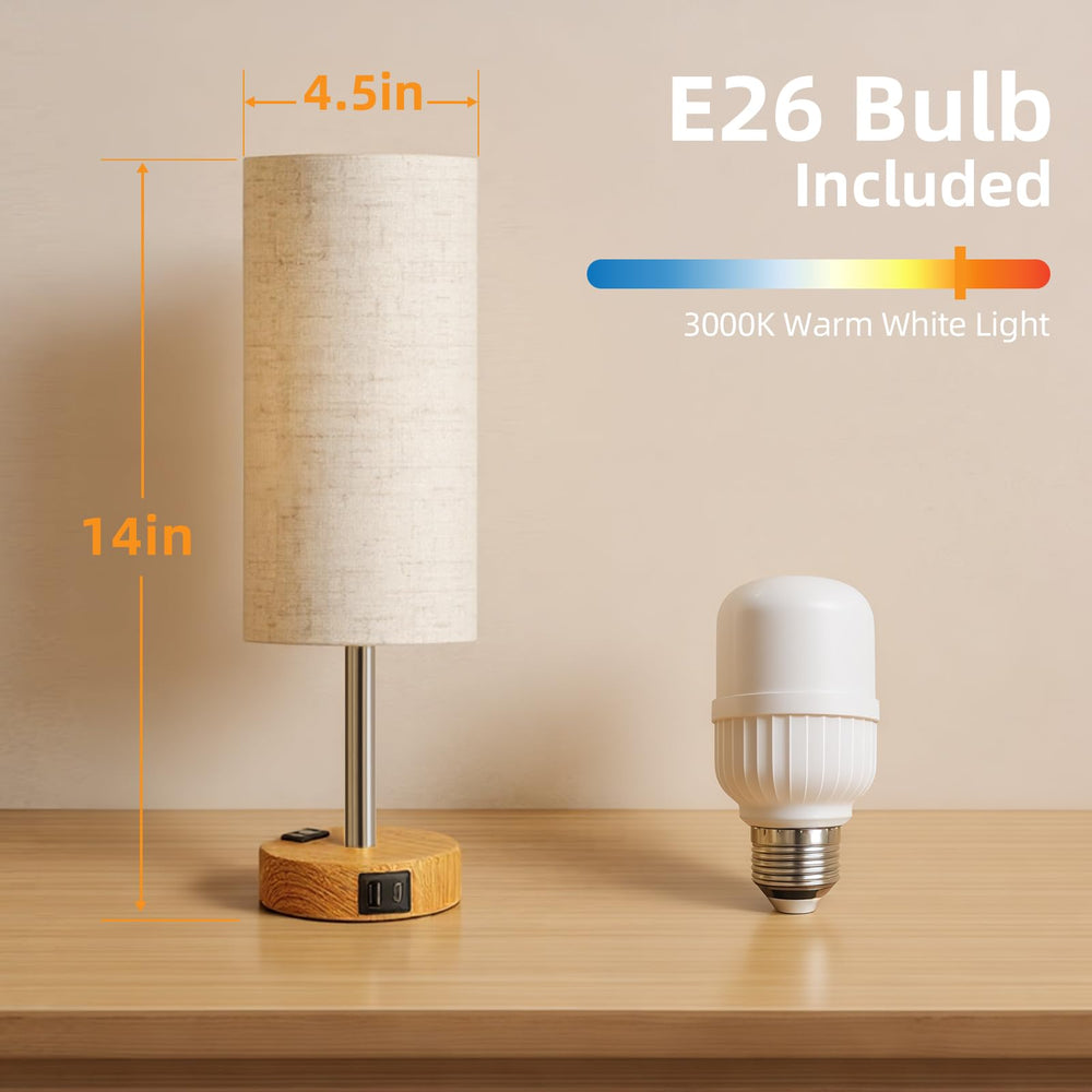 Fitfull lamp next to book to show compact scale and bedside fit