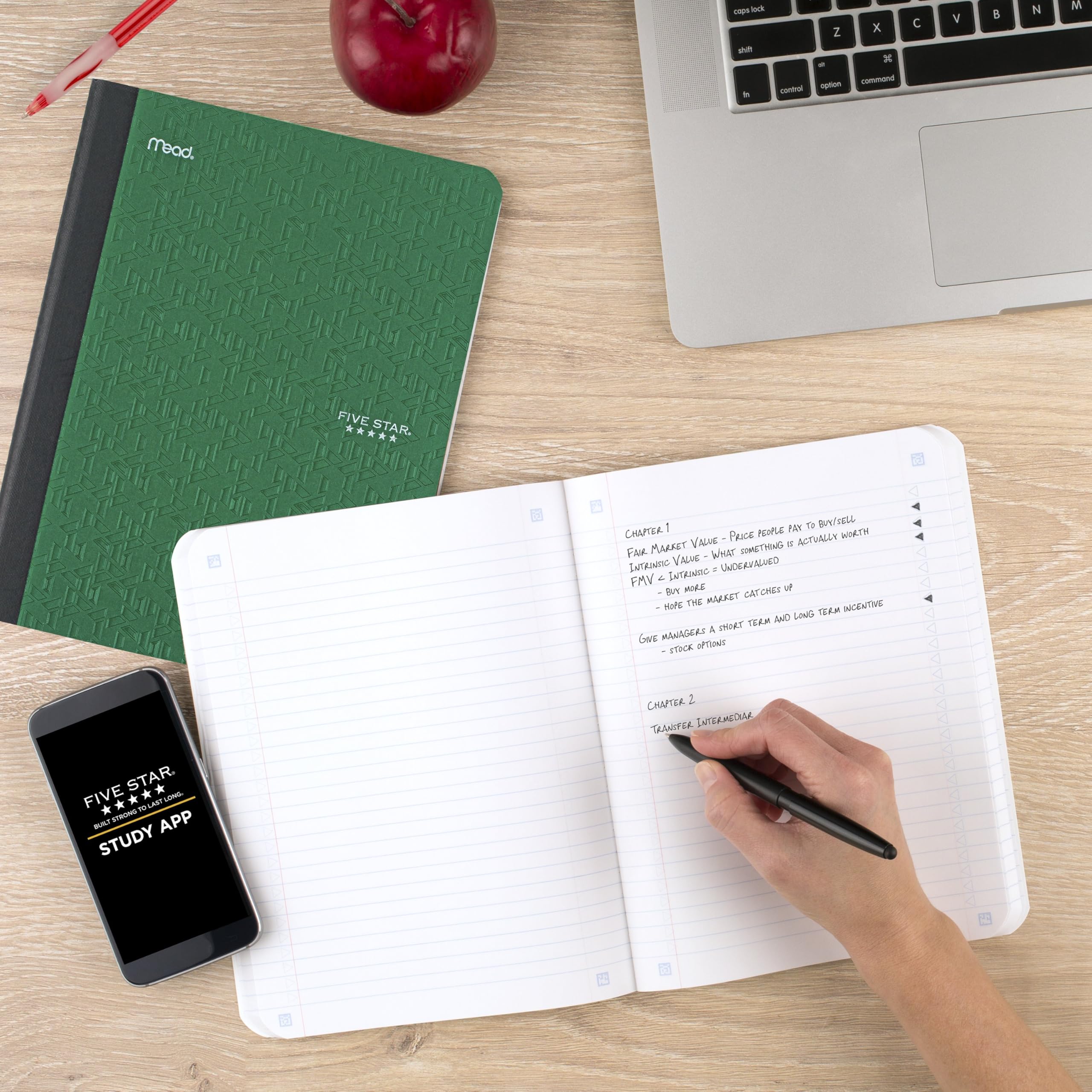 Five Star composition book beside a backpack showing compact, portable size