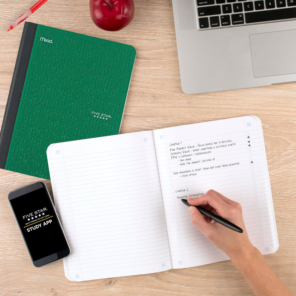 Five Star composition book beside a backpack showing compact, portable size