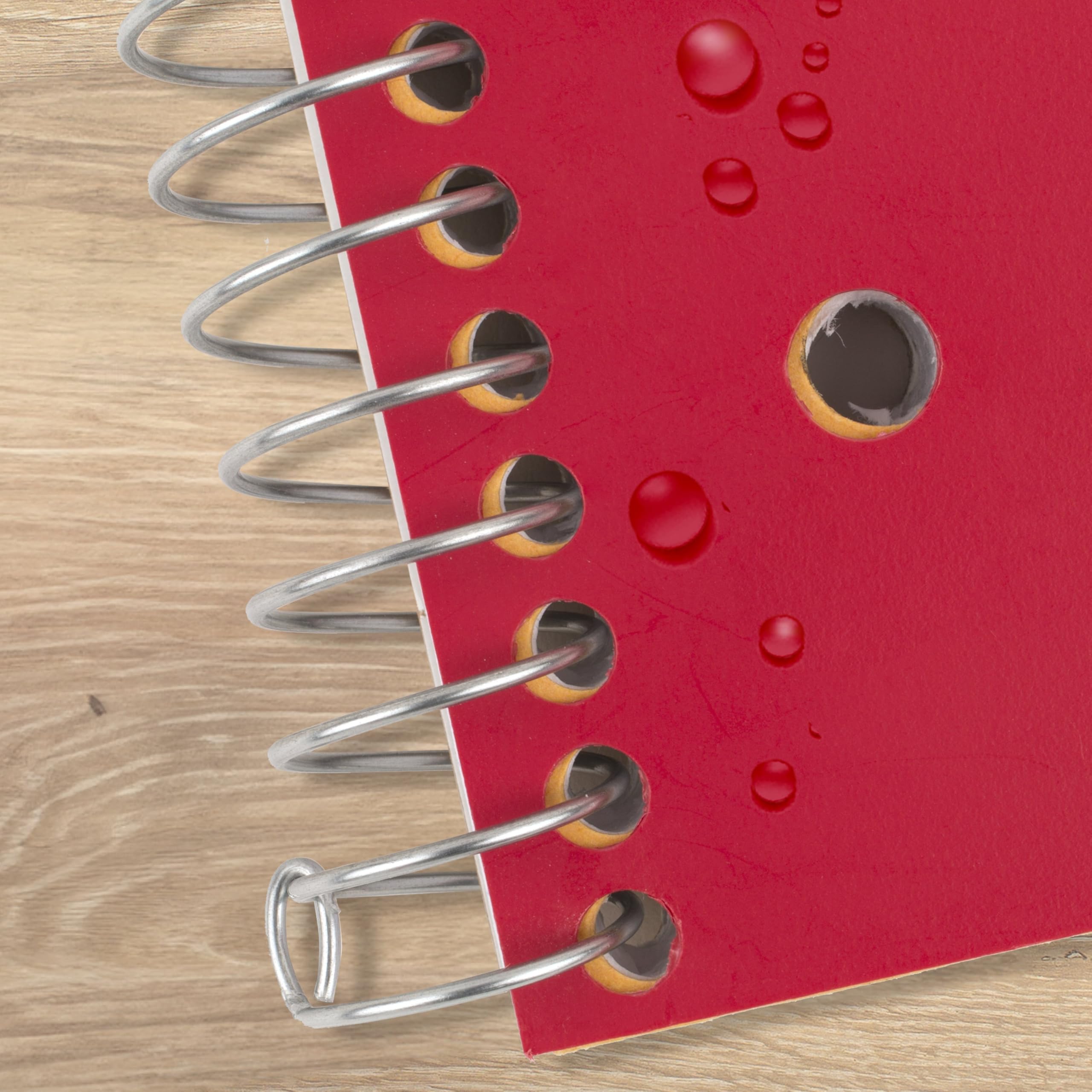 Five Star notebook beside a standard folder showing true 8.5x11 size for scale