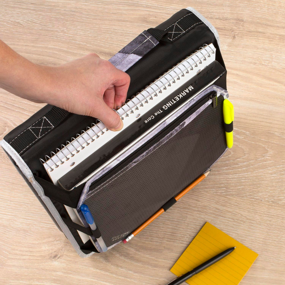 Five Star binder placed in backpack showing compact fit and easy portability