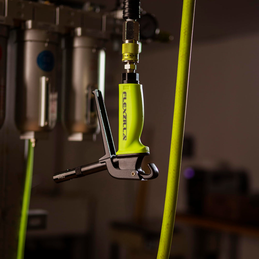 Flexzilla hose alongside ruler demonstrating 50 ft length and lightweight portability