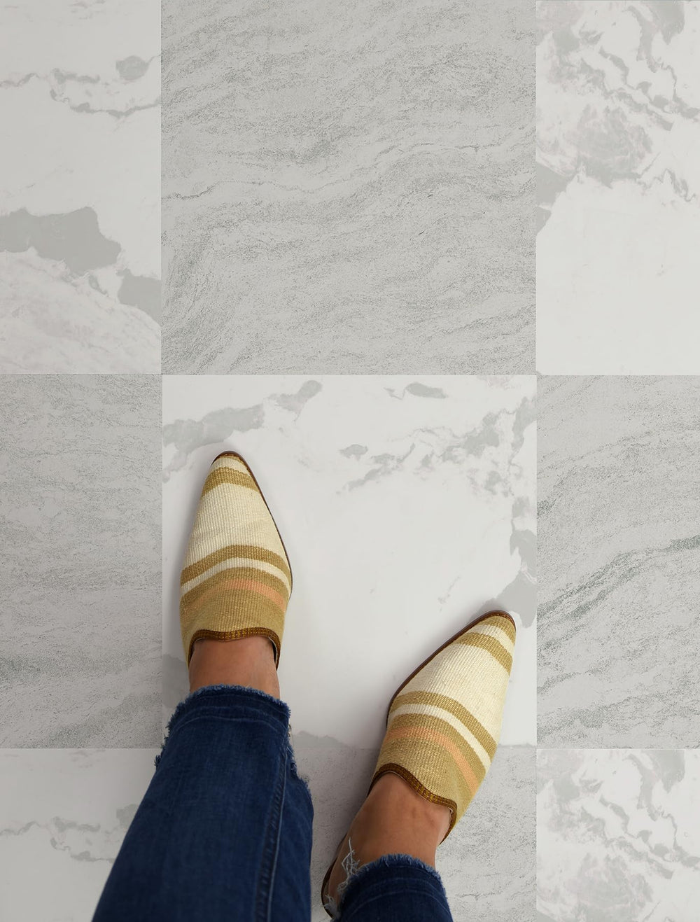 FloorPops Bonneville Beige tile being wiped clean to show washable, water-resistant surface