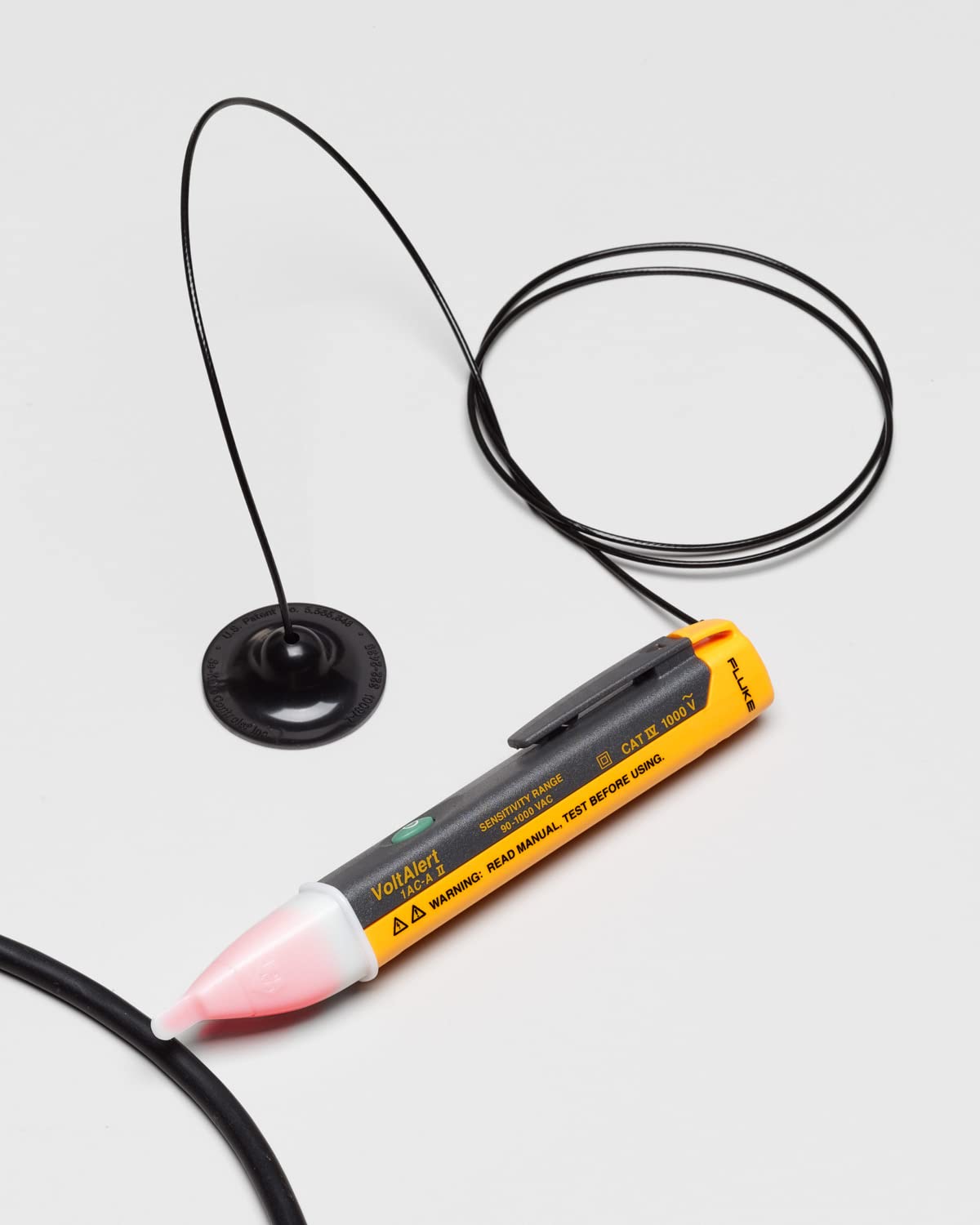 Fluke tip close-up lit red indicating voltage for quick visual safety