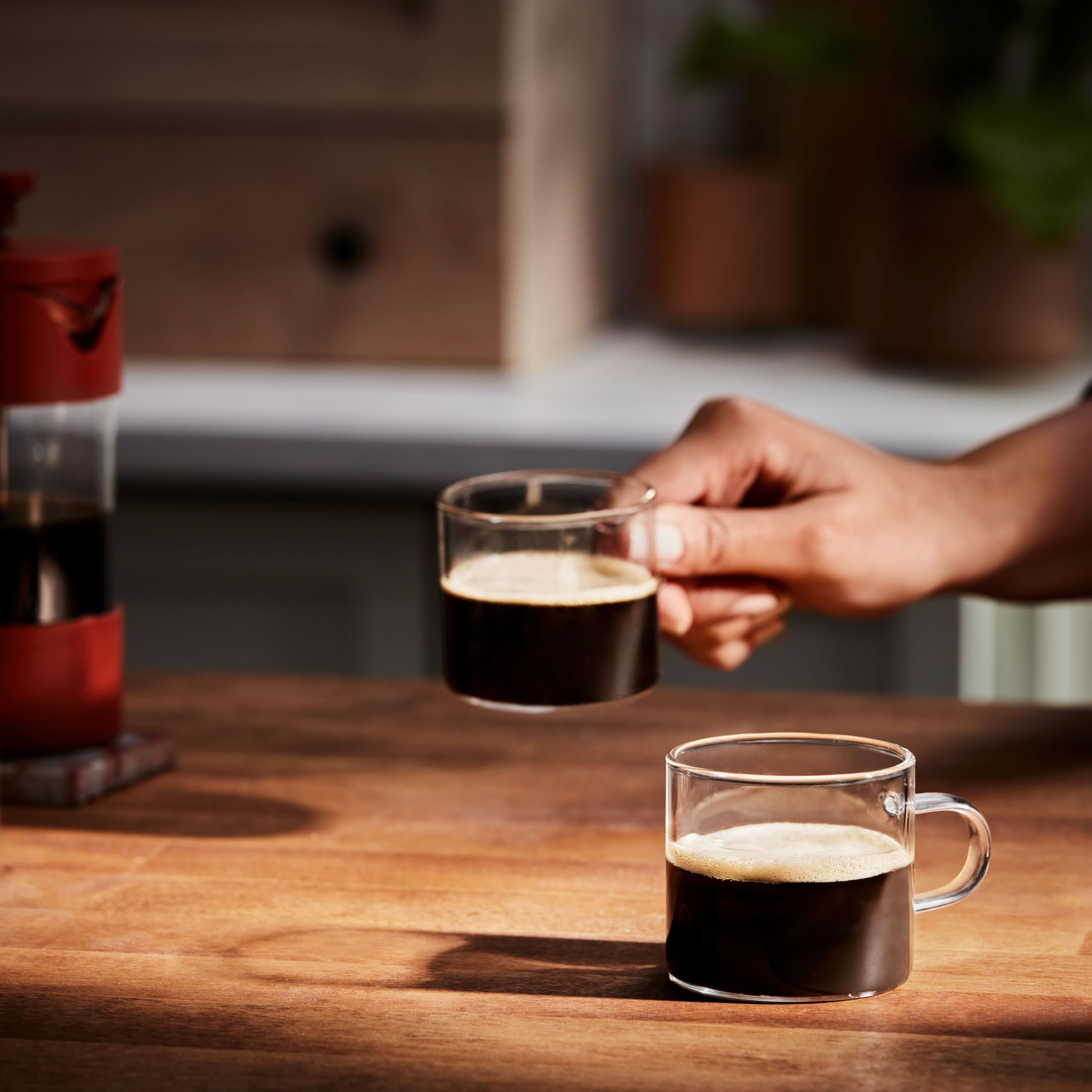 Folgers half caff pod beside ruler to show pod size for scale and compatibility