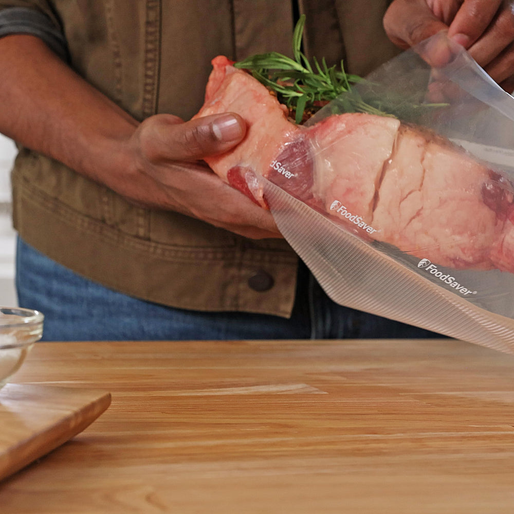 FoodSaver stacked vacuum-sealed bags in freezer showing space saving organization