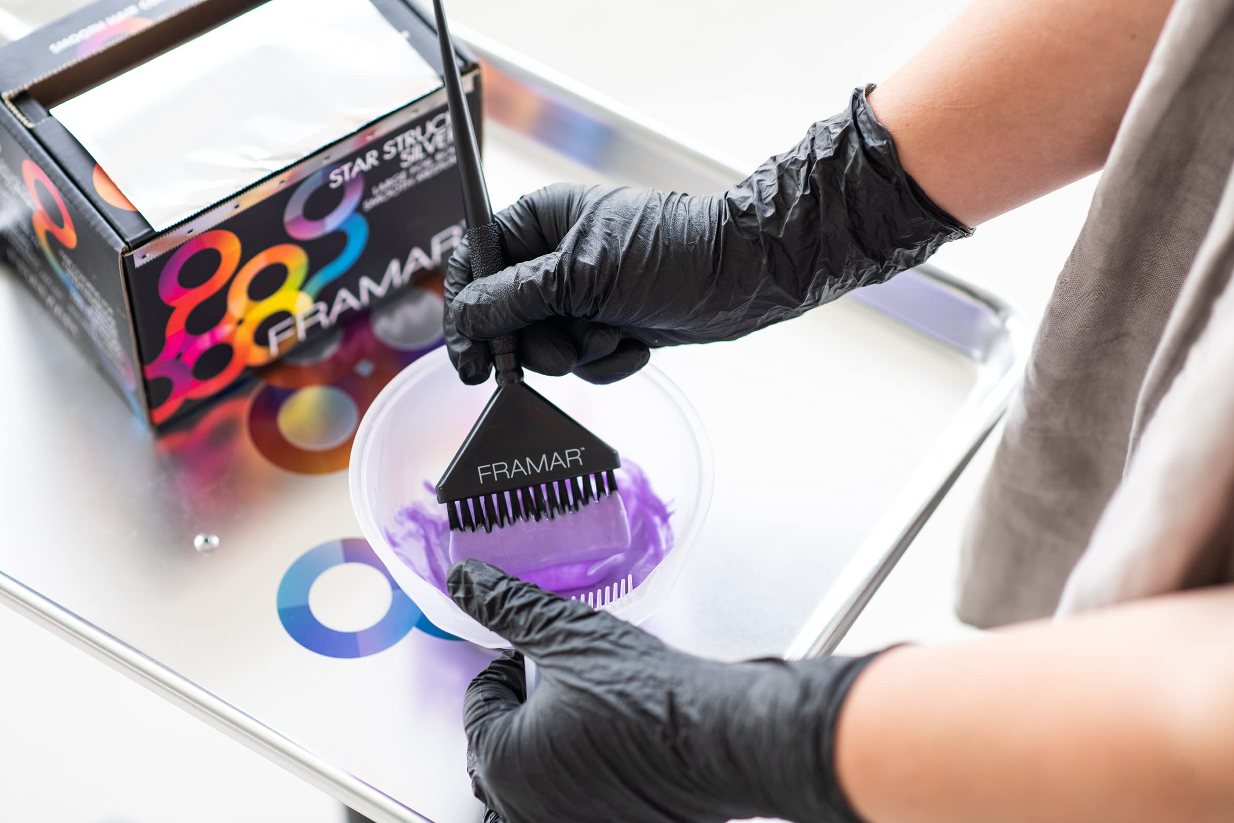 FRAMAR glove worn during hair coloring showing stain protection benefit
