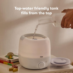 Frida mist coming from dual spout showing even room coverage benefit