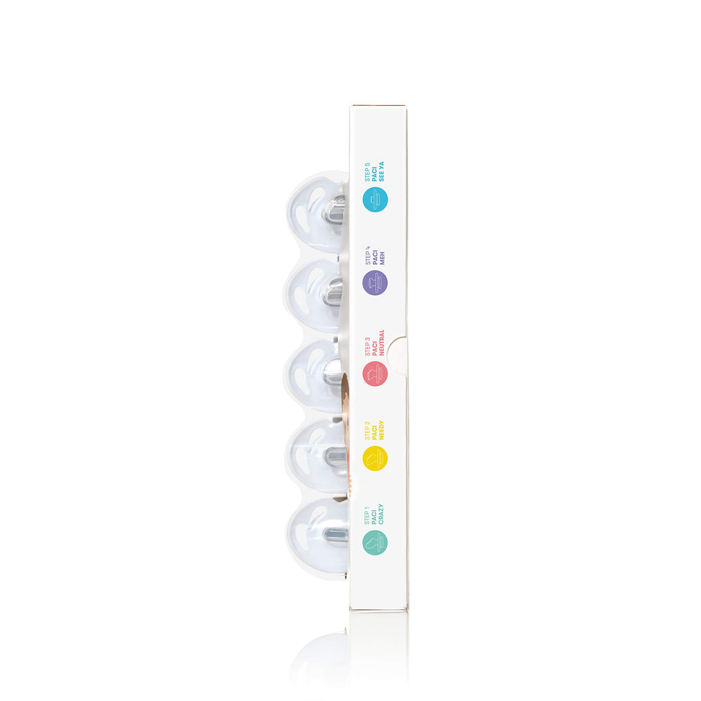 Frida pacifiers on dishwasher top rack indicating easy hygienic cleaning