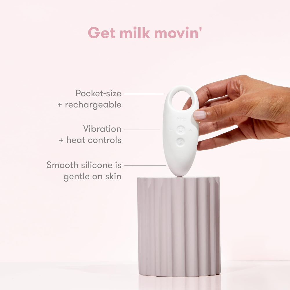 Frida Mom massager placed in a nursing bra for hands-free support while feeding, increases comfort