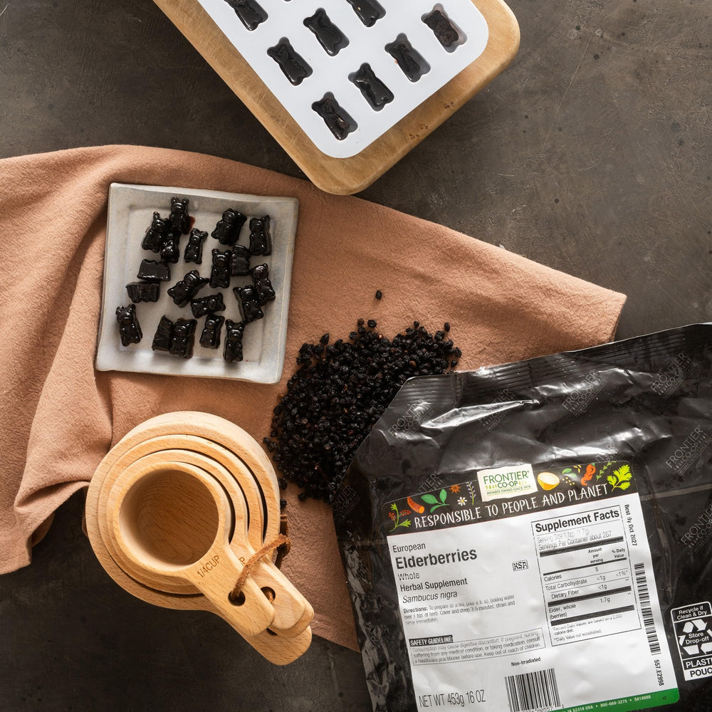 Frontier Co-op elderberries in bowl with measuring spoon for portioning and recipe prep