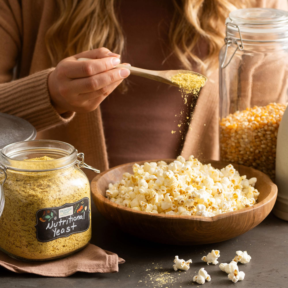 Frontier Co-op flakes dusted over pasta to enhance umami and richness