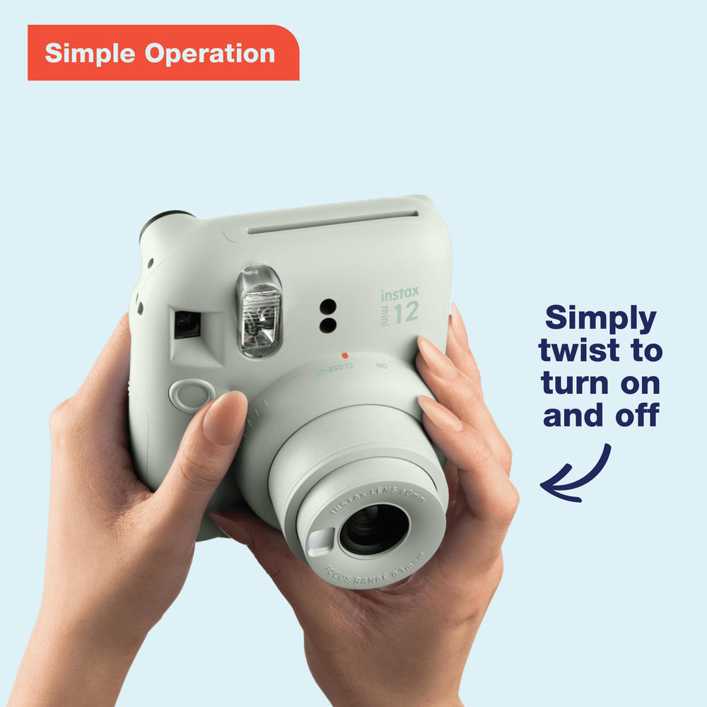 Fujifilm Instax Mini 12 open lens close-up highlighting easy twist power and mode