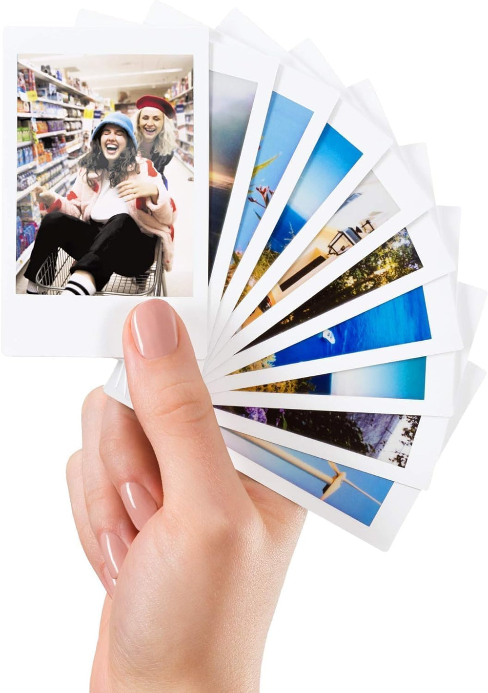 Hand holding a developed Fujifilm Instax photo highlighting instant-share enjoyment