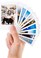 Hand holding a developed Fujifilm Instax photo highlighting instant-share enjoyment
