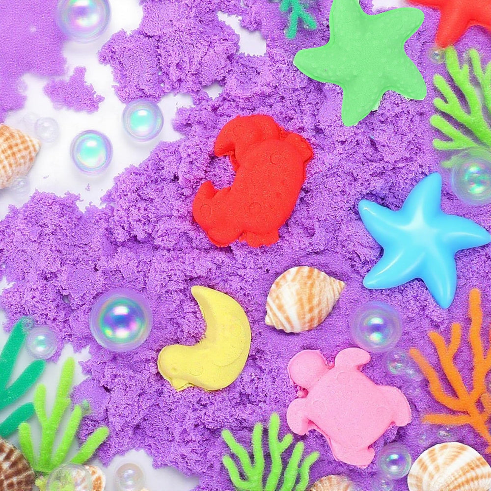FURWEY hand scooping sand from a tray showing easy cleanup and tactile engagement