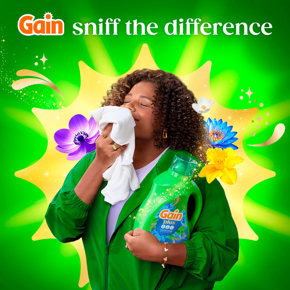 Gain Plus dispensed into washing machine drum showing compatibility and low-suds formula