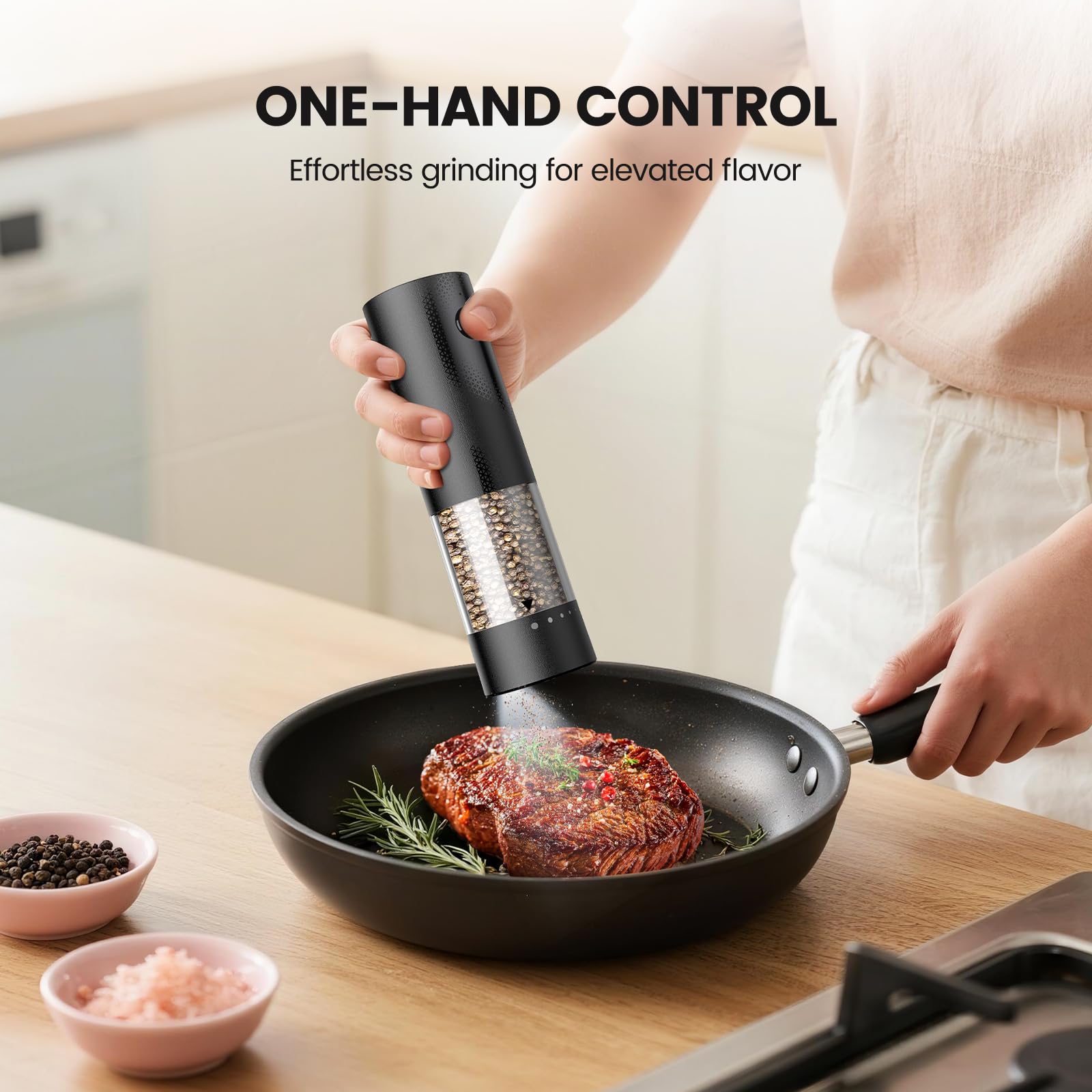 Gaivis grinders in use on a dinner table for effortless one-handed seasoning