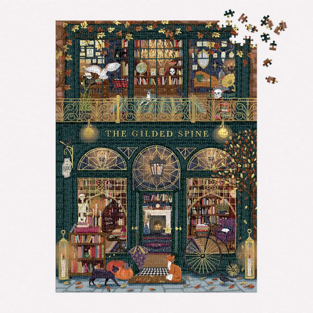 Galison puzzle in progress on dining table showing social assembly and ongoing build benefit