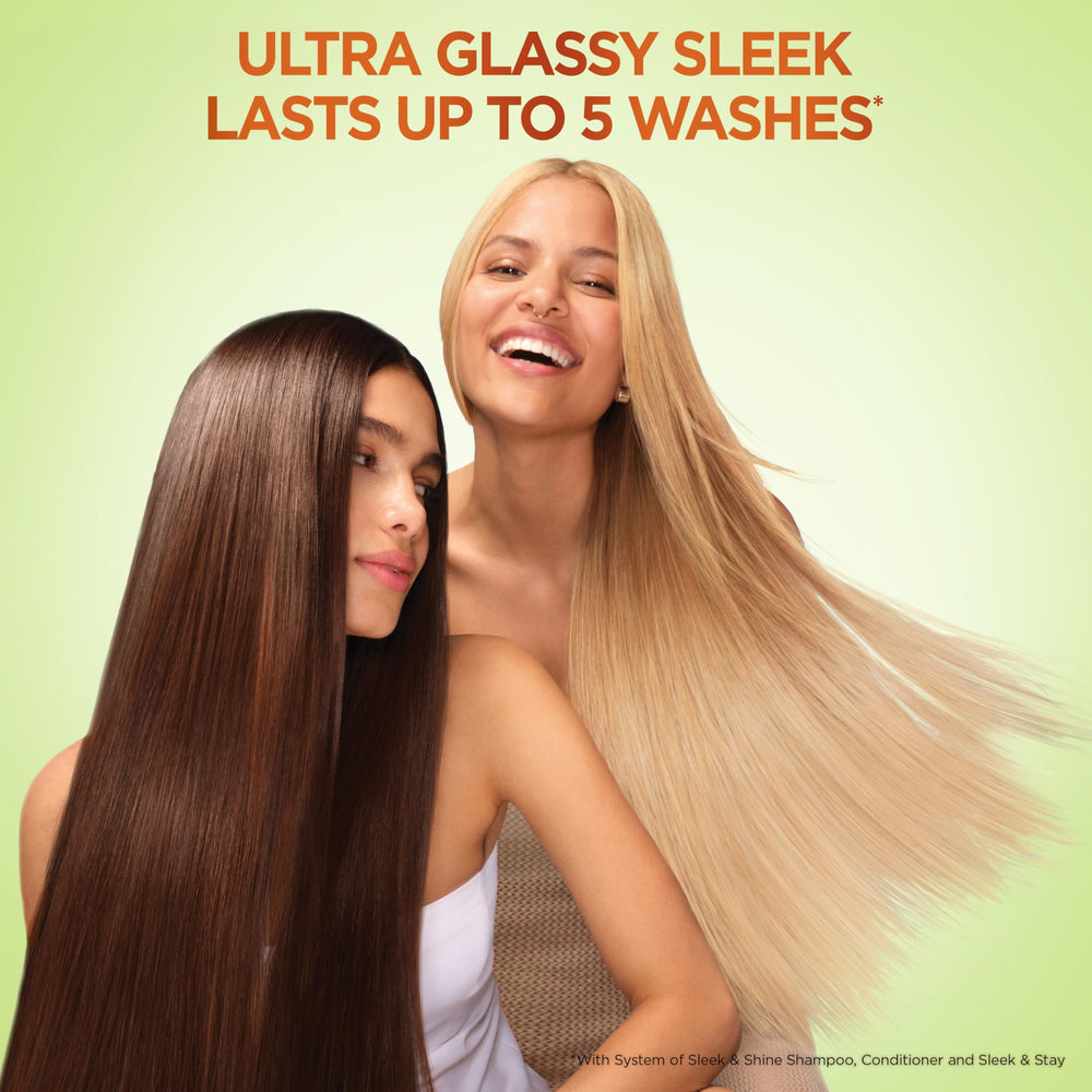Garnier Fructis size comparison next to common bottle to show 22 and 21 fl oz