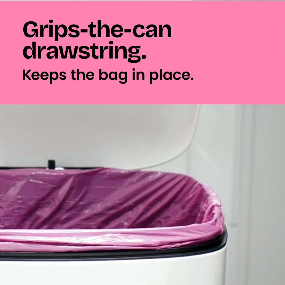 Glad full bag being carried by drawstring showing comfortable transport and leak control