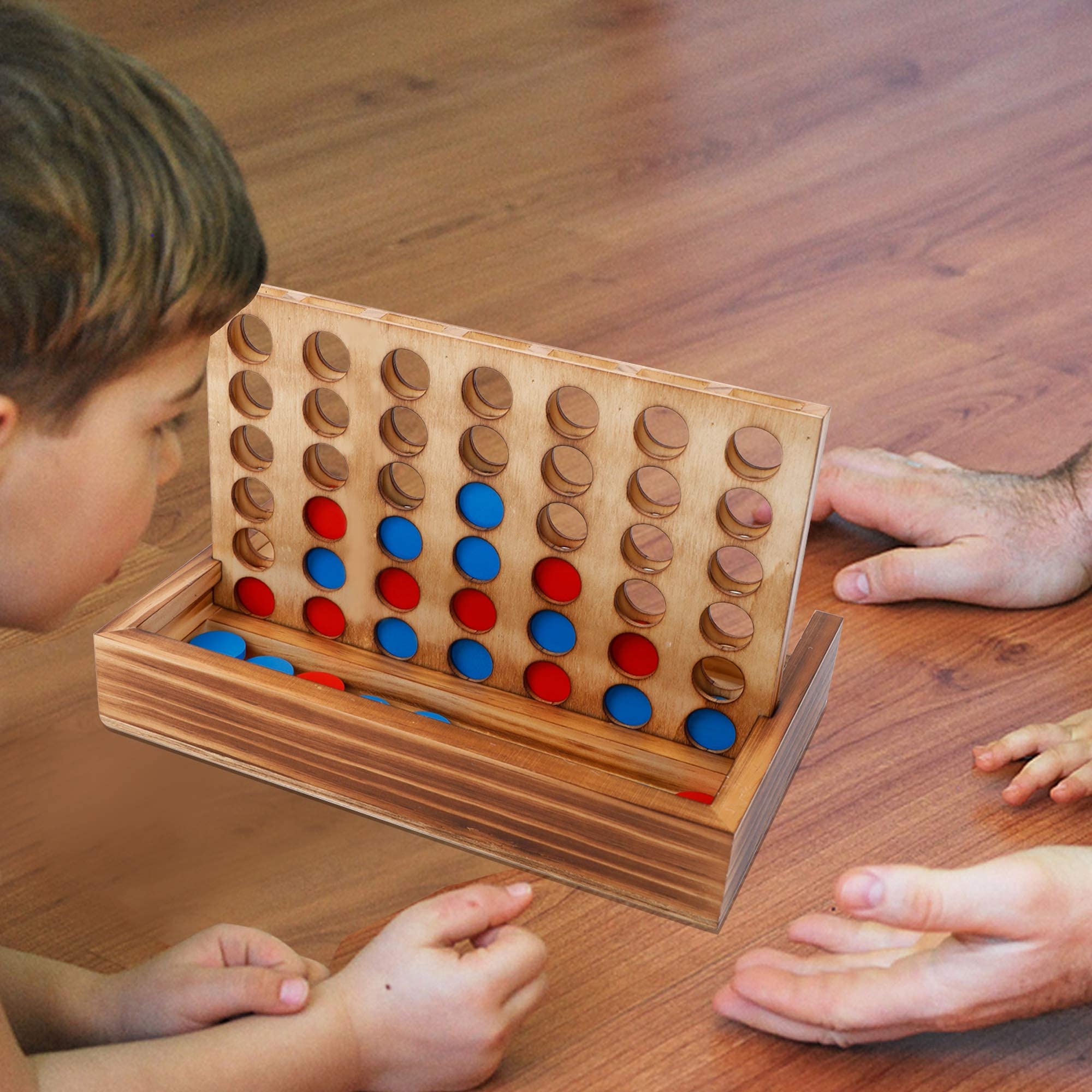 Glintoper family playing on living room table showing social engagement benefit
