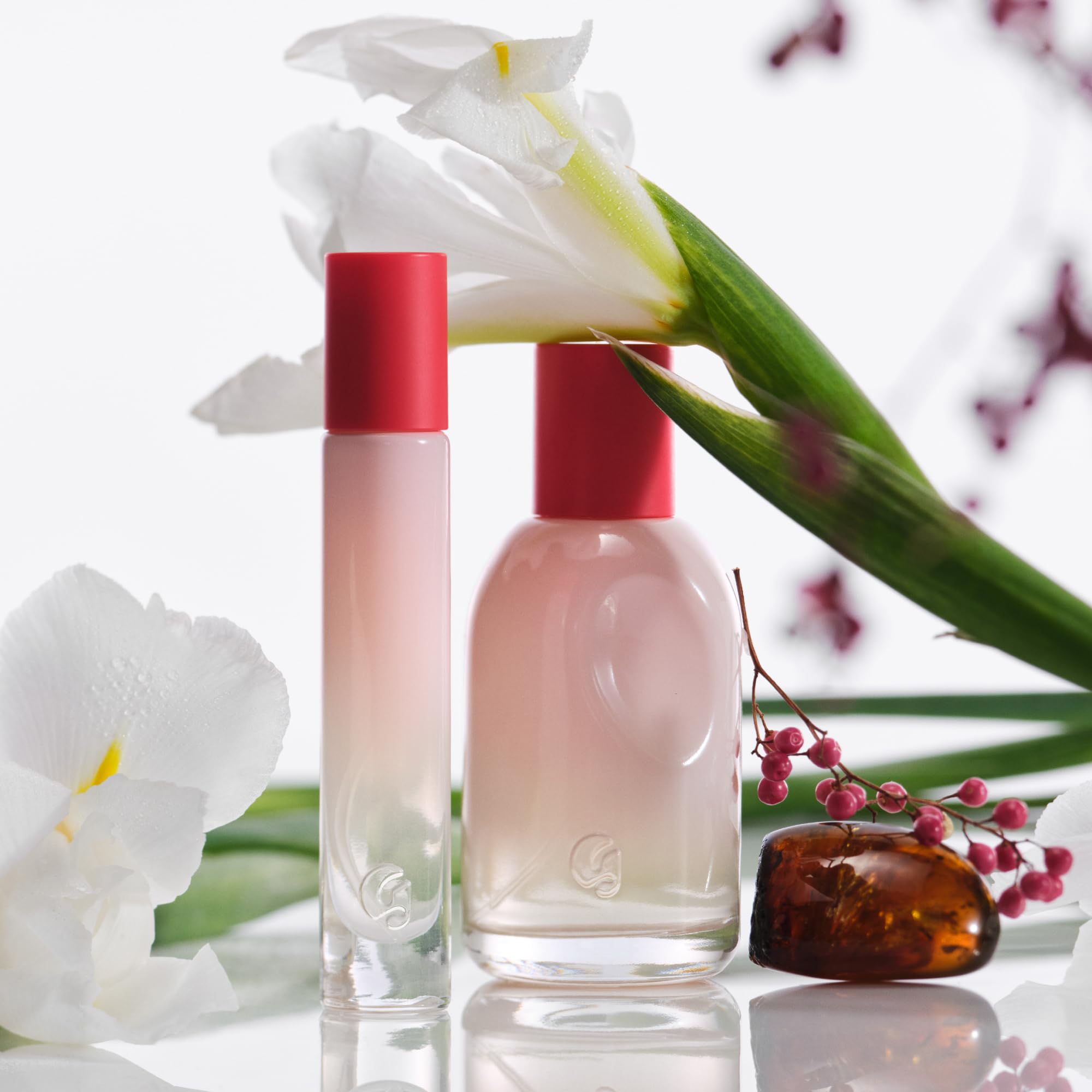 Glossier You bottle paired with Crème de You to boost scent longevity