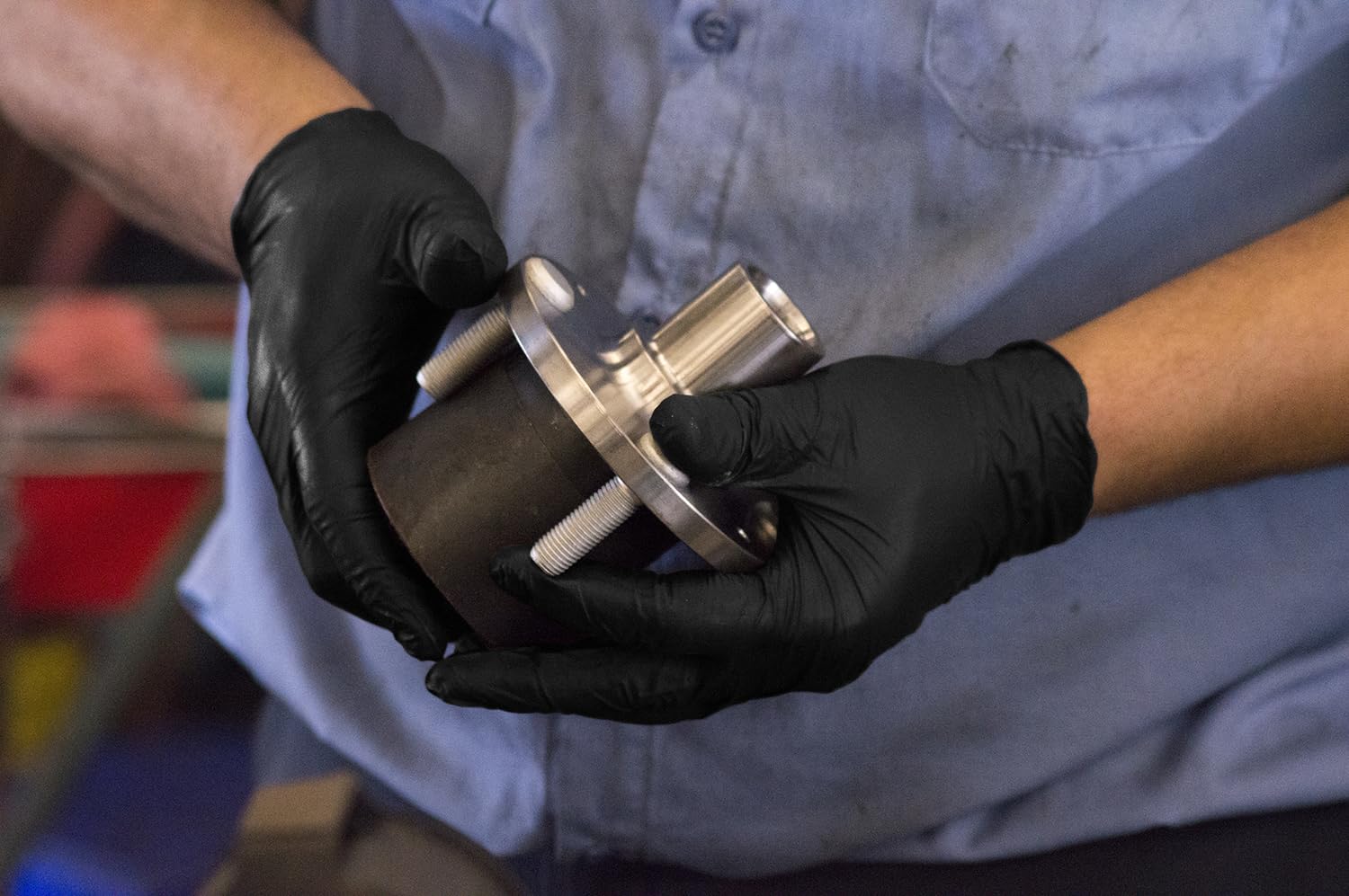 GLOVEWORKS opened box dispensing gloves showing easy grab and workplace readiness benefit