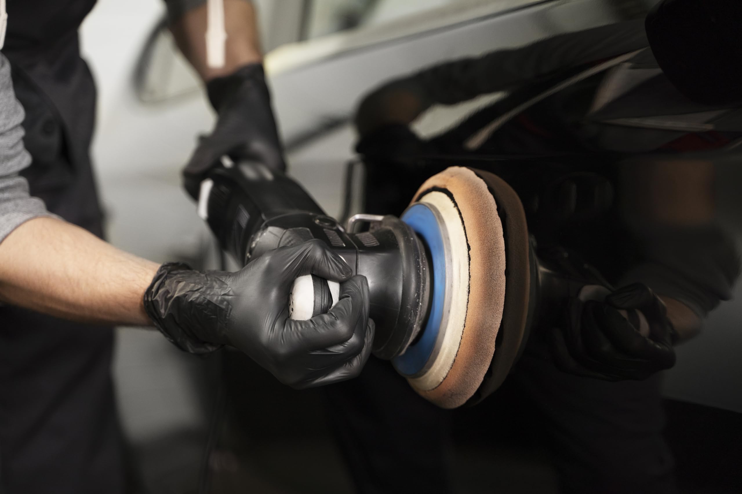 GLOVEWORKS gloves in automotive shop protecting hands from grease