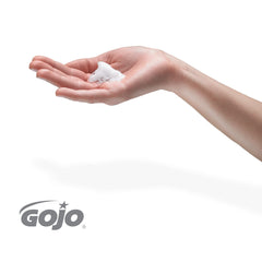 GOJO foam texture in hand showing rich cranberry-scented foam that rinses clean for quicker sinks