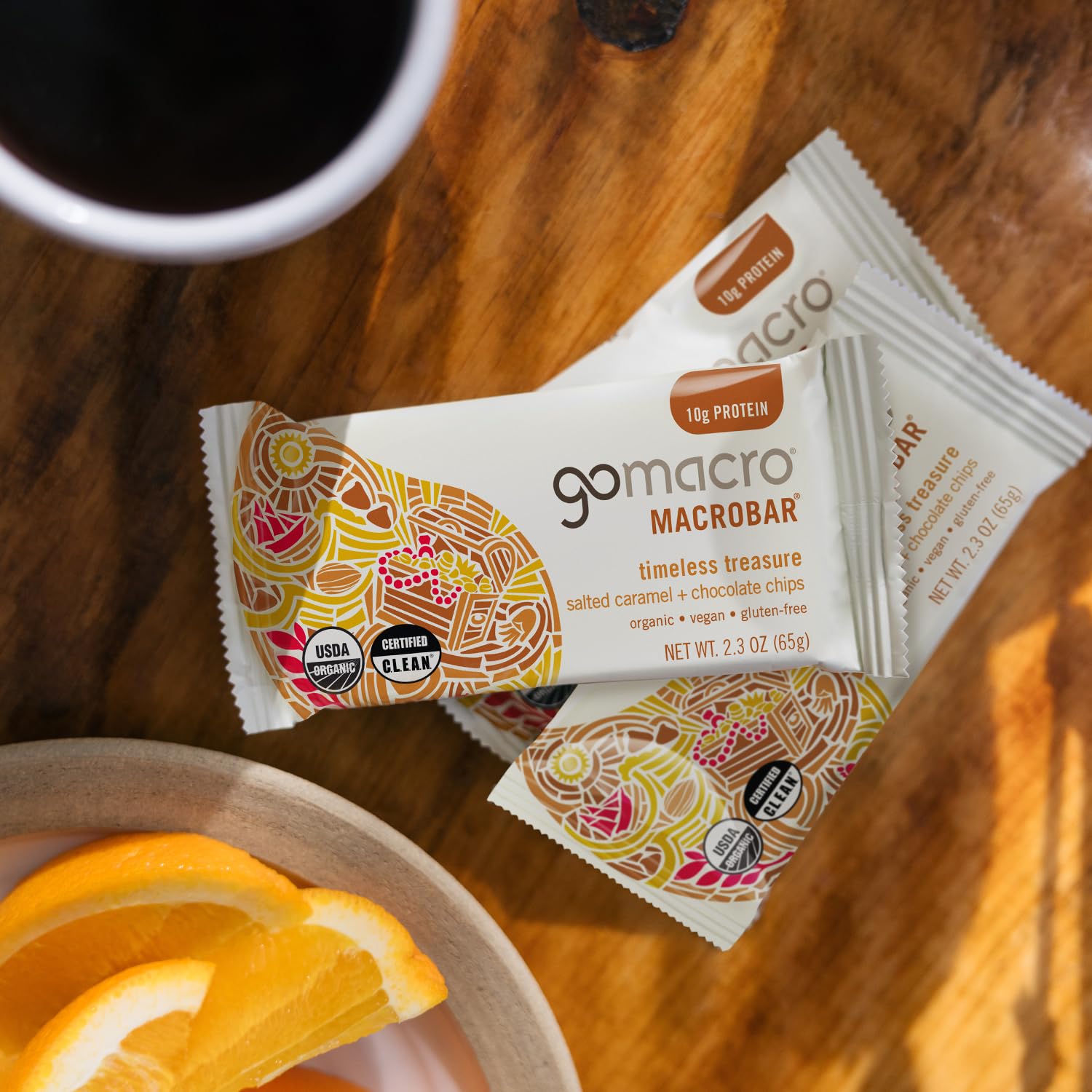 GoMacro bar cut open to reveal vegan chocolate chips and caramel inside, emphasizing indulgent flavor