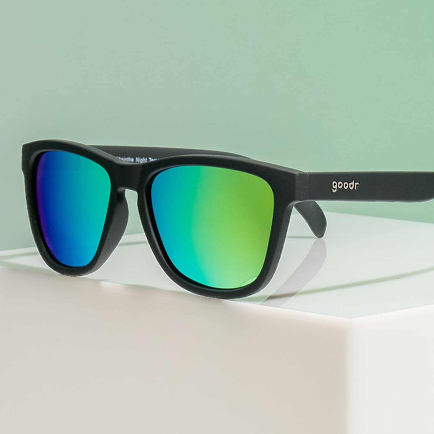 goodr sunglasses next to smartphone for size and scale reference before buying