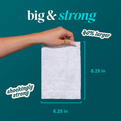 goodwipes folded wipe beside a hand showing extra-large size for improved coverage