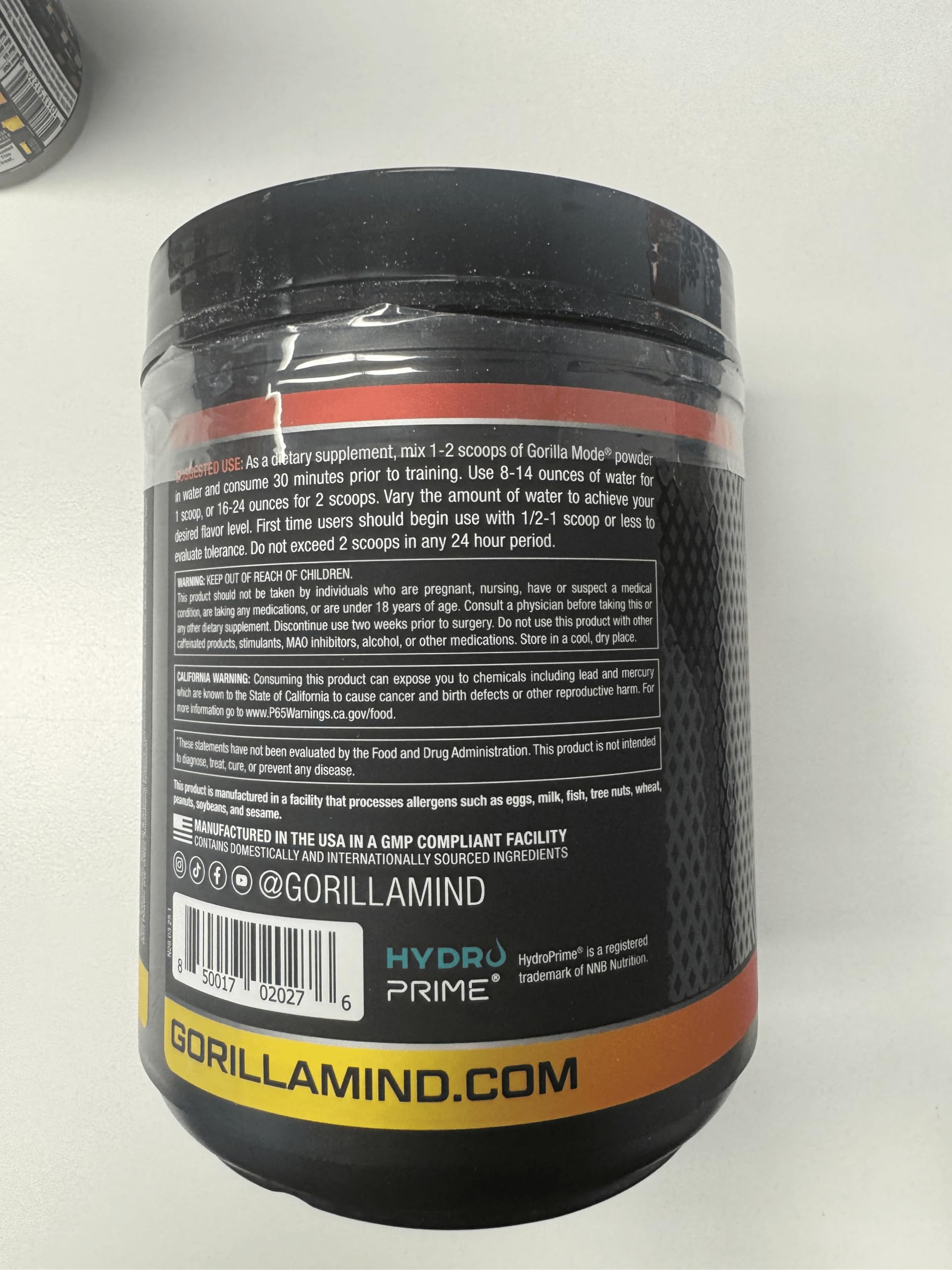 Gorilla Mind powder being poured into a shaker bottle illustrating easy mixing and portability