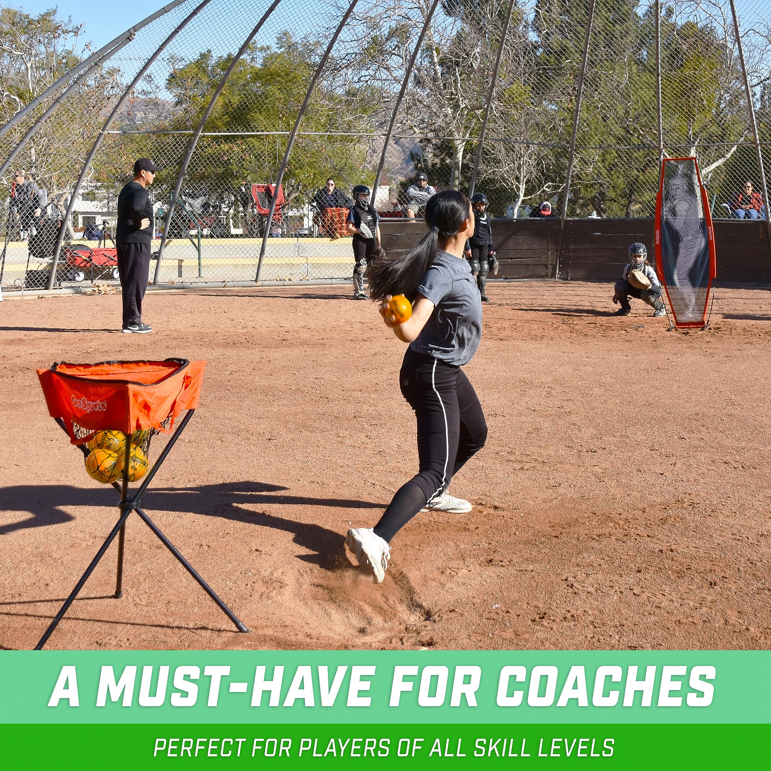 GoSports coach demonstrating pitching drill using weighted softball to refine delivery