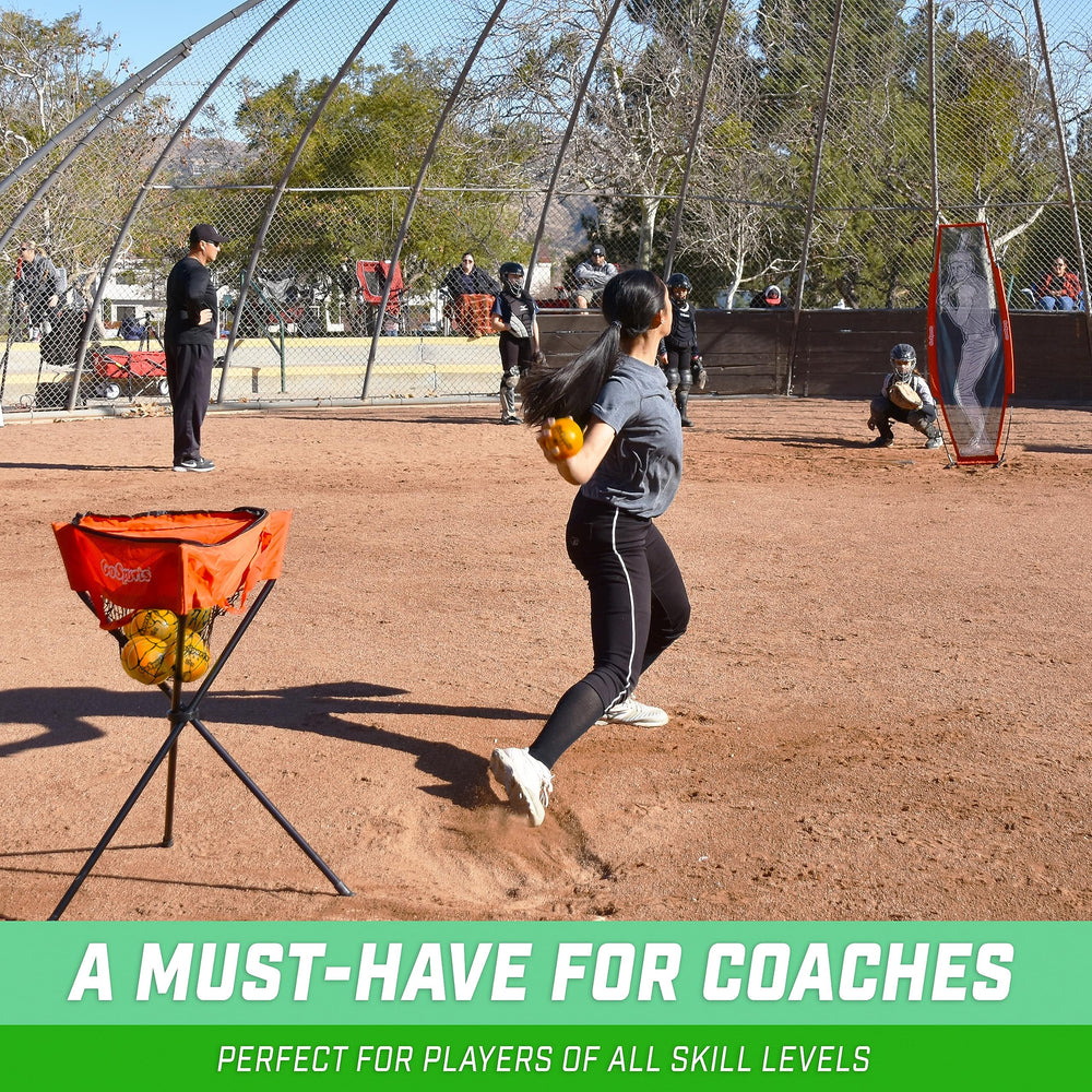 GoSports coach demonstrating pitching drill using weighted softball to refine delivery