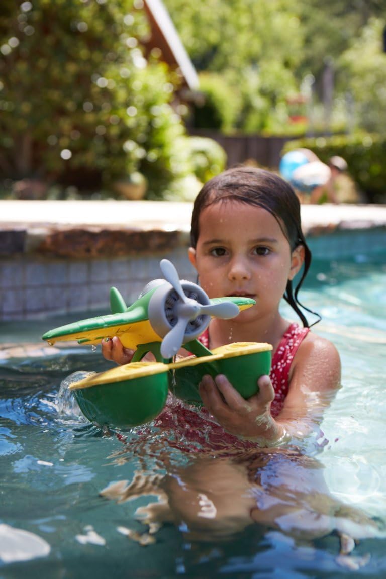 Green Toys seaplane propeller close-up demonstrating spinning motion for engaging sensory play
