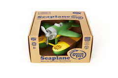 Green Toys seaplane in bathtub with toddler playing, promoting fine motor practice and safe water fun