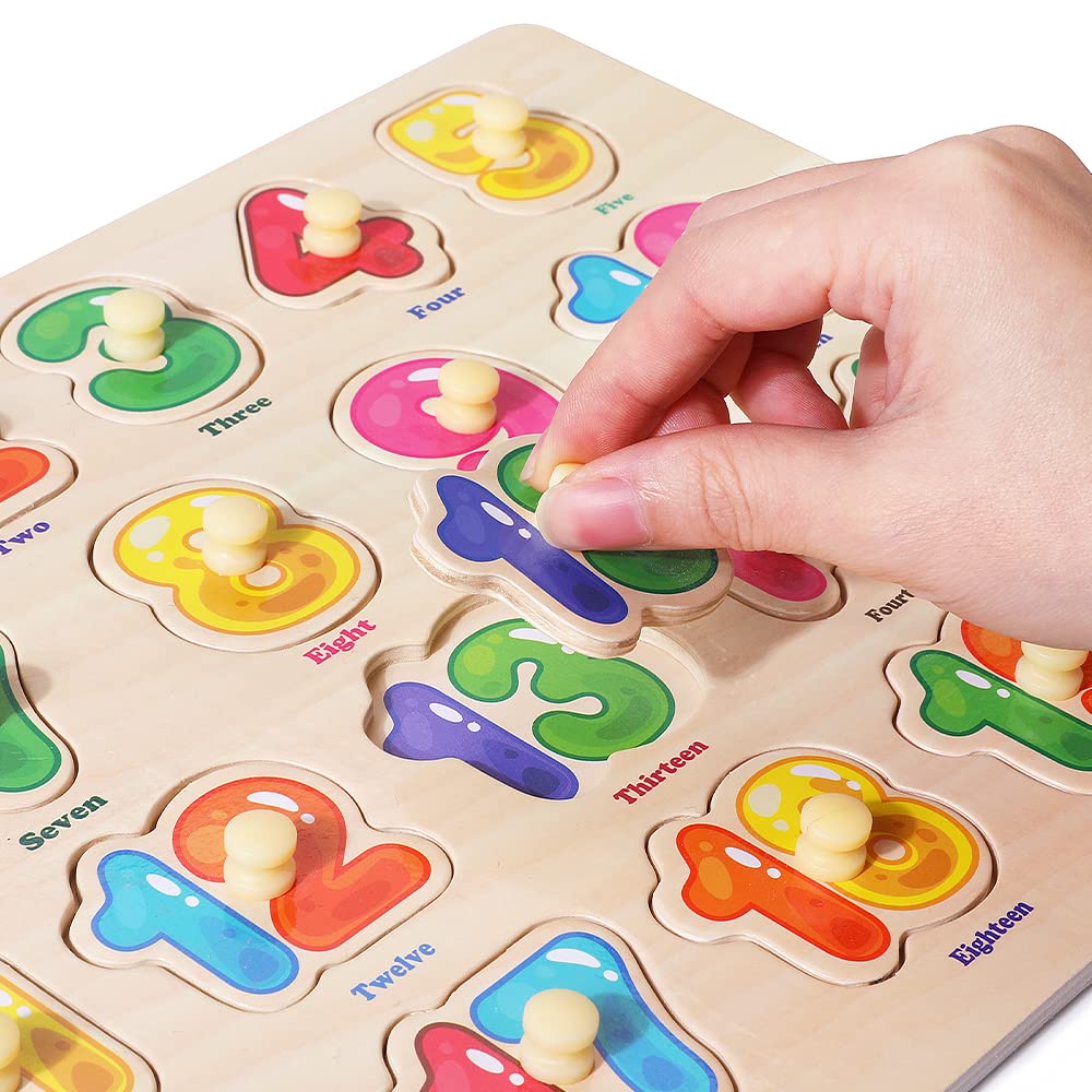 GRINNNIE peg size compared to toddler hand demonstrating ergonomic fit for fine-motor benefit