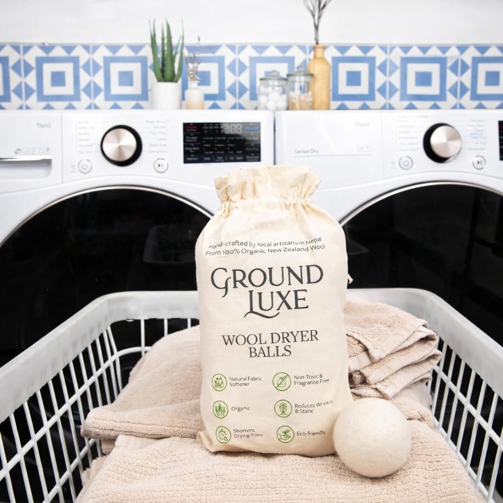 GroundLuxe balls in laundry basket lifestyle promoting eco-friendly laundry